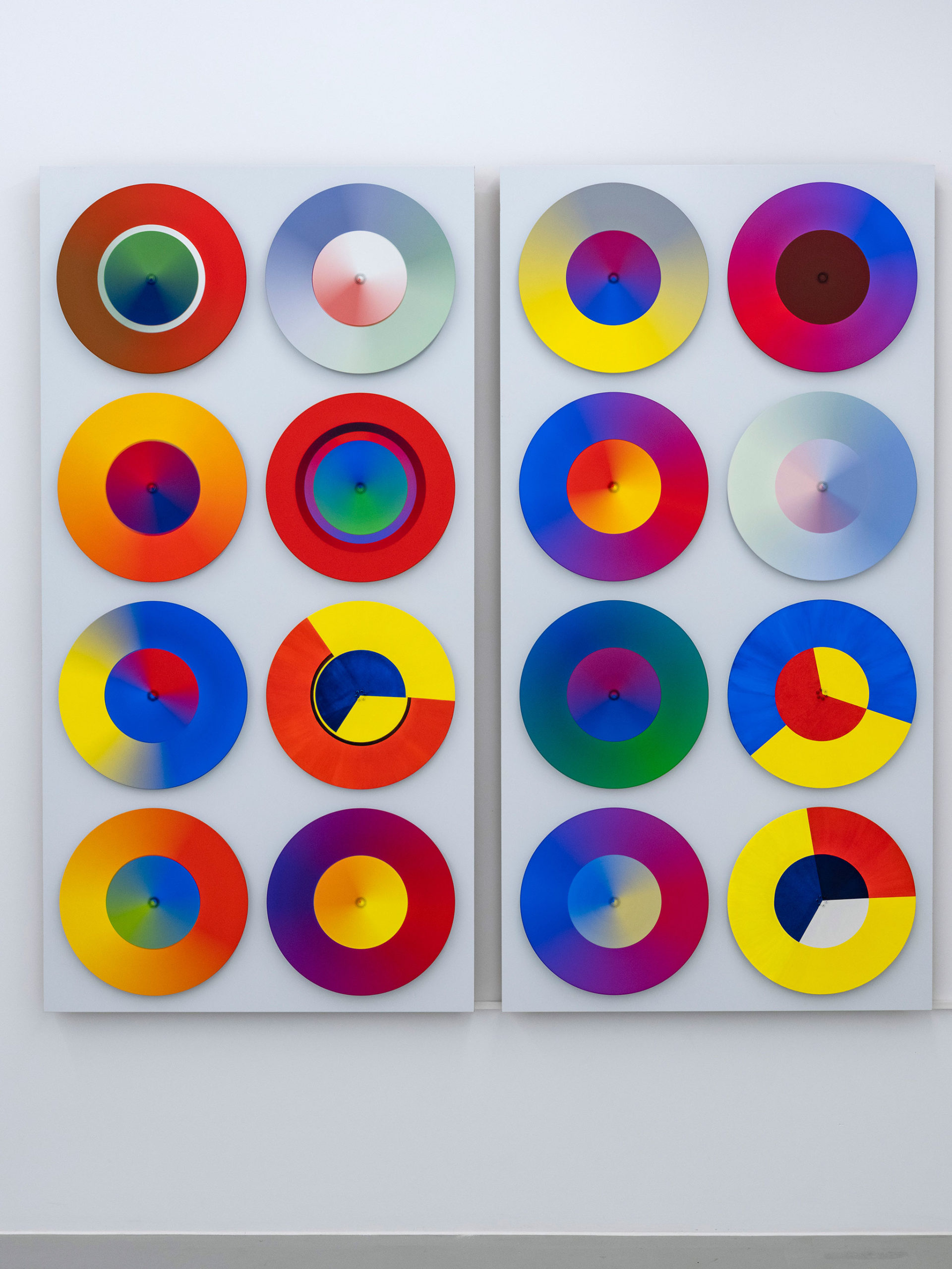Mama Ocllo is a large kinetic painting of 16 spinning disks made by Madeleine Kelly and shown at Milani Gallery, printed in artist profile magazine